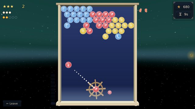 Navigation: a board of blue, red and yellow bubbles, the aim line rising from the ship's wheel